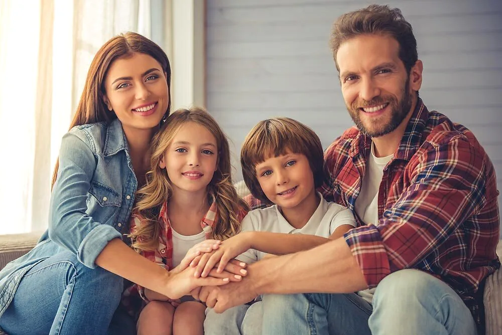 Family sitting together on a porch