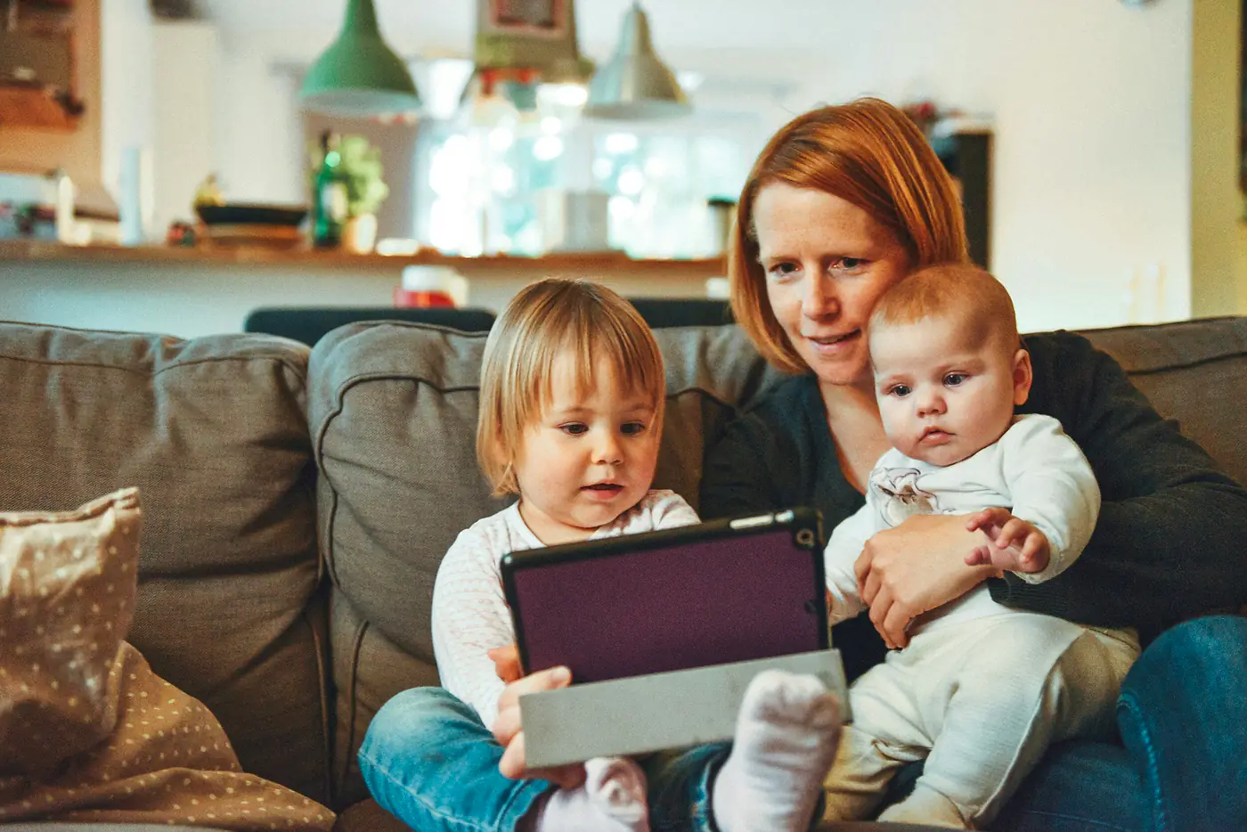 Mother with a toddler and a baby